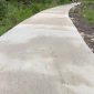 Jalan Rabat Beton di RT 08, Dusun Bahari, Desa Kuala Simbur, Selasa (10/9/24). FOTO : bj